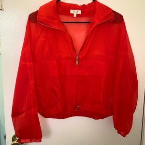Bright red zip up top
